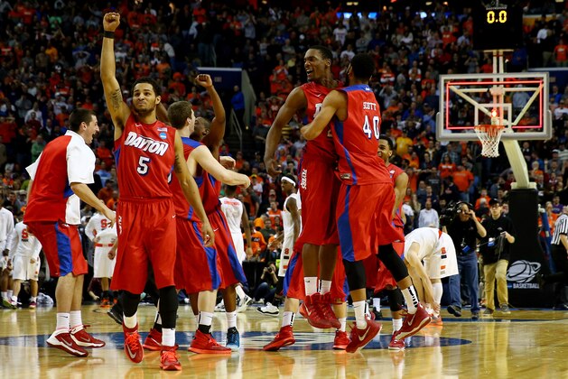 BUFFALO, NY - MARCH 22:  Devin Oliver #5 of the Dayton Flyers reacts after defeating the Syracuse Orange 55-53 in the third round of the 2014 NCAA Men's Basketball Tournament at the First Niagara Center on March 22, 2014 in Buffalo, New York.  (Photo by Elsa/Getty Images)