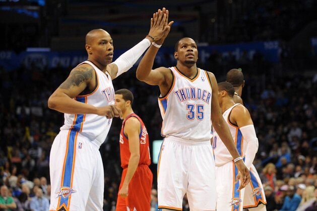 Mar 4, 2014; Oklahoma City, OK, USA; Oklahoma City Thunder small forward Caron Butler (2) congratulates Oklahoma City Thunder small forward Kevin Durant (35) after a made shot against the Philadelphia 76ers at Chesapeake Energy Arena. Mandatory Credit: Mark D. Smith-USA TODAY Sports