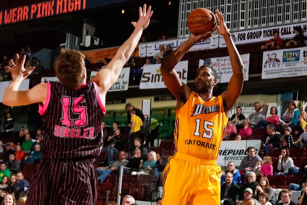 BOISE, ID - FEBRUARY 1:  Shawne Williams #15 of the Los Angeles D-Fenders shoots over EJ Singler #15 of the Idaho Stampede during an NBA D-League game on February 1, 2014 at CenturyLink Arena in Boise, Idaho. The Stampede wore pink jerseys for a mammography assistance fund auction. NOTE TO USER: User expressly acknowledges and agrees that, by downloading and/or using this Photograph, user is consenting to the terms and conditions of the Getty Images License Agreement. Mandatory Copyright Notice: Copyright 2014 NBAE (Photo by Otto Kitsinger/NBAE via Getty Images)