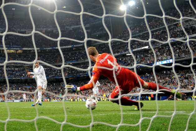 MADRID, SPAIN - MARCH 18:  Goalkeeper Ralf Fahrmann of Schalke dives in vain as Alvaro Morata of Real Madrid scores his team's third goal during the UEFA Champions League Round of 16, second leg match between Real Madrid and FC Schalke 04 at Estadio Santiago Bernabeu on March 18, 2014 in Madrid, Spain.  (Photo by Denis Doyle/Getty Images)