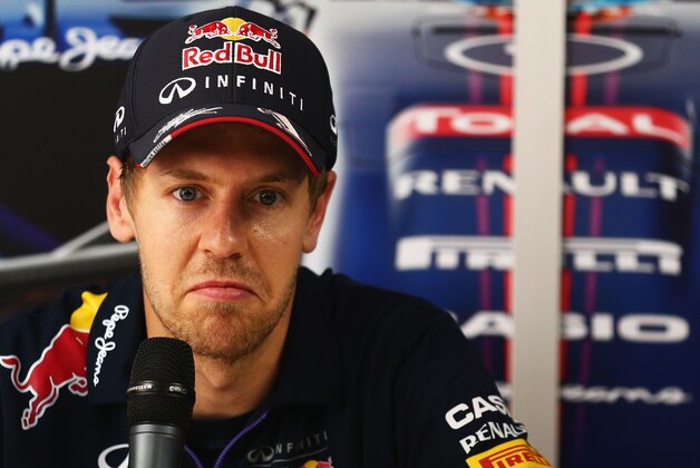 KUALA LUMPUR, MALAYSIA - MARCH 27:  Sebastian Vettel of Germany and Infiniti Red Bull Racing is interviewed by the media during previews to the Malaysia Formula One Grand Prix at the Sepang Circuit on March 27, 2014 in Kuala Lumpur, Malaysia.  (Photo by Clive Mason/Getty Images)