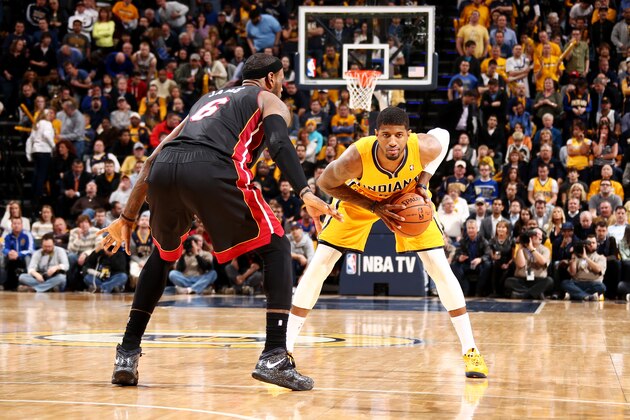 INDIANAPOLIS, IN - MARCH 26: Paul George #24 of the Indiana Pacers looks to drive against LeBron James #6 of the Miami Heat during a game on March 26, 2014 at Bankers Life Fieldhouse in Indianapolis, IN.  NOTE TO USER: User expressly acknowledges and agrees that, by downloading and or using this photograph, User is consenting to the terms and conditions of the Getty Images License Agreement. Mandatory Copyright Notice: Copyright 2014 NBAE  (Photo by Nathaniel S. Butler/NBAE via Getty Images)