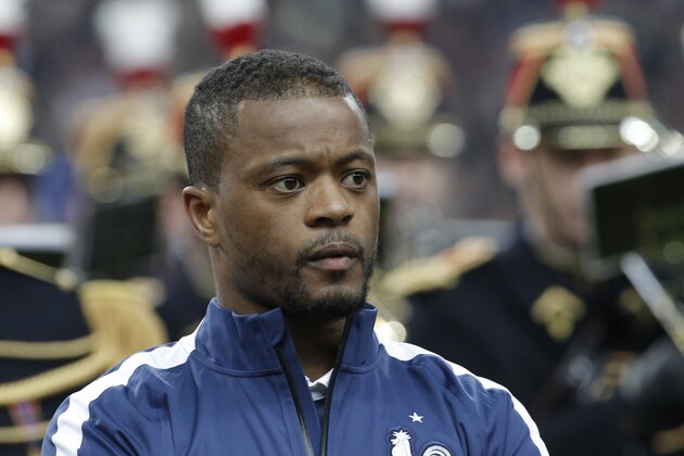 Patrice Evra of France pose before the international friendly match between France and Netherlands at the Stade de France stadium, outside Paris, Wednesday, March 5, 2014. (AP Photo/Christophe Ena)