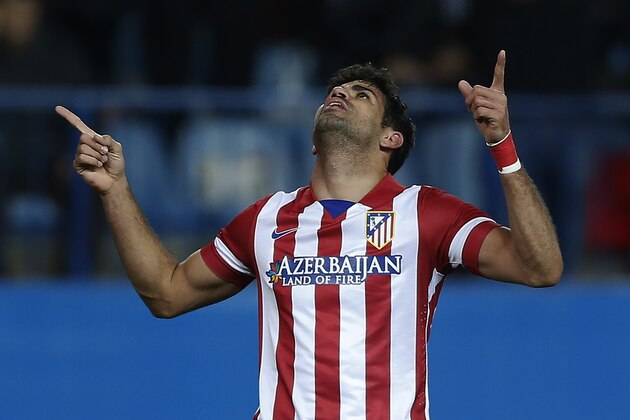 Atletico's Diego Costa celebrates his goal during a Spanish La Liga soccer match between Atletico Madrid and Granada at the Vicente Calderon stadium in Madrid, Spain, Wednesday, March 26, 2014. (AP Photo/Andres Kudacki)