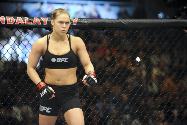 Feb 22, 2014; Las Vegas, NV, USA;  Ronda Rousey (red gloves) prior to the start of her fight against Sara McMann (blue gloves) for their UFC bantamweight championship bout at Mandalay Bay. Mandatory Credit: Stephen R. Sylvanie-USA TODAY Sports
