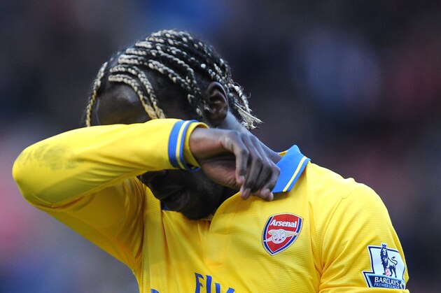 Arsenal's Bacary Sagna  leaves the field after the English Premier League soccer match between Stoke City and Arsenal at Britannia Stadium in Stoke On Trent, England, Saturday, March 1, 2014. (AP Photo/Rui Vieira)