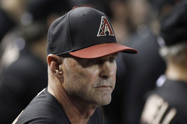 PHOENIX, AZ - SEPTEMBER 14:  Manager Kirk Gibson #23 of the Arizona Diamondbacks looks on from the dugout during the second inning of a MLB game against the Colorado Rockies at Chase Field on September 14, 2013 in Phoenix, Arizona.  (Photo by Ralph Freso/Getty Images)