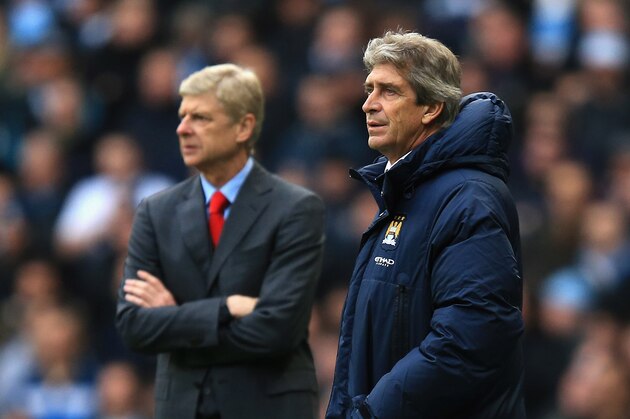 MANCHESTER, ENGLAND - DECEMBER 14: Arsene Wenger manager of Arsenal and Manuel Pellegrini manager of Manchester City look on during the Barclays Premier League match between Manchester City and Arsenal at Etihad Stadium on December 14, 2013 in Manchester, England. (Photo by Richard Heathcote/Getty Images)
