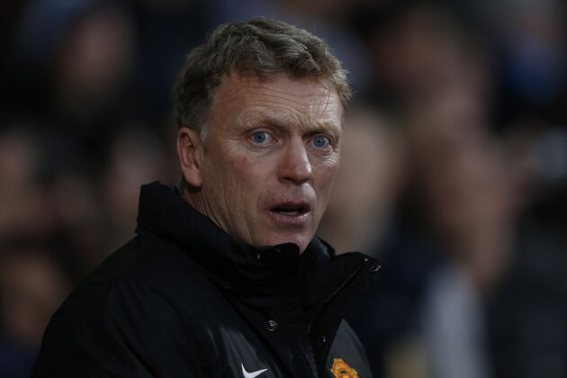 Manchester United's manager David Moyes looks on from the dugout before the start of their English Premier League soccer match against West Ham United at Upton Park, London, Saturday, March 22, 2014. (AP Photo/Sang Tan)