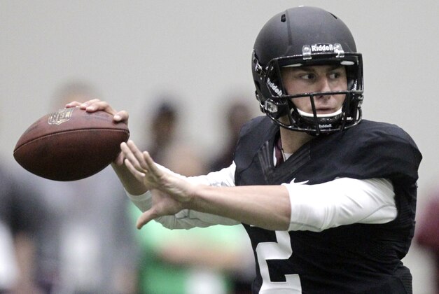 Texas A&M quarterback Johnny Manziel passes the ball during a drill at pro day for NFL football representatives in College Station, Texas, Thursday, March 27, 2014. (AP Photo/Patric Schneider)