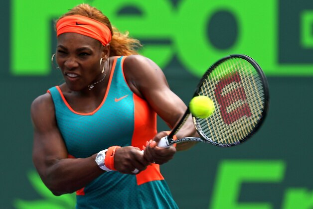 KEY BISCAYNE, FL - MARCH 27:  Serena Williams returns a shot to Maria Sharapova of Russia during their match on Day 11 of the Sony Open at the Crandon Park Tennis Center on March 27, 2014 in Key Biscayne, Florida.  (Photo by Mike Ehrmann/Getty Images)