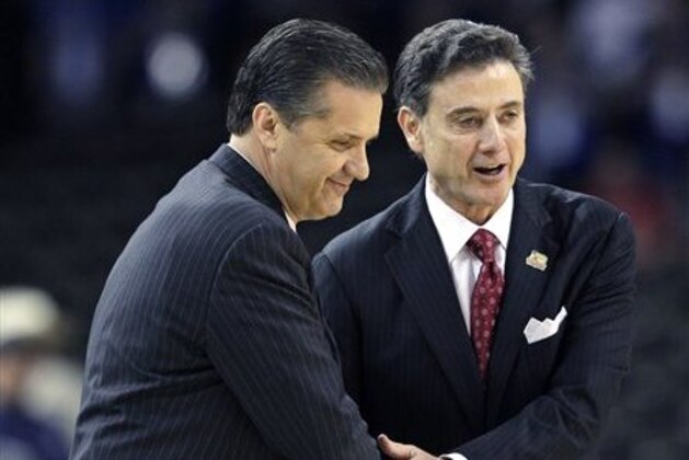 FILE - in this March 31, 2012, file photo,  Louisville head coach Rick Pitino, right, shakes hands with Kentucky head coach John Calipari before the first half of an NCAA Final Four semifinal college basketball tournament game in New Orleans. Kentucky has fallen out of the Top 25 and the defending national champs are still looking to establish themselves heading into the instate showdown with rival Louisville. The fourth-ranked Cardinals Saturday will try to end a four-game skid against the Wildcats. (AP Photo/David J. Phillip, File)