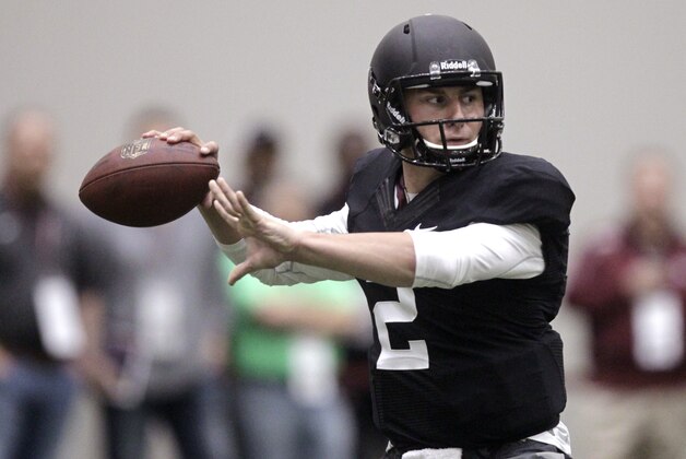 Texas A&M quarterback Johnny Manziel passes the ball during a drill at pro day for NFL football representatives in College Station, Texas, Thursday, March 27, 2014. (AP Photo/Patric Schneider) Texas A&M quarterback Johnny Manziel passes the ball during a drill at pro day for NFL football representatives in College Station, Texas, Thursday, March 27, 2014. (AP Photo/Patric Schneider)