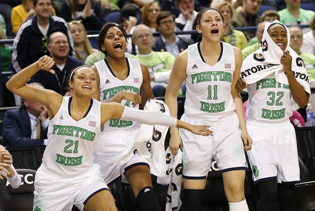 Mar 8, 2014; Greensboro, NC, USA; Notre Dame Fighting Irish players Kayla McBride (21), Ariel Braker (44), Natalie Achonwa (11) and Jewell Loyd (32) react during the closing minute against North Carolina State at the Greensboro Coliseum. Mandatory Credit: Ellen Ozier-USA TODAY Sports