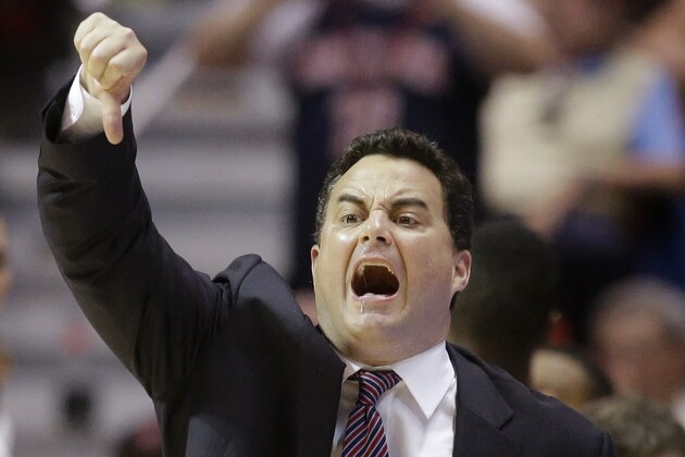 Arizona head coach Sean Miller gestures to his team as they play Gonzaga during the first half of a third-round game in the NCAA college basketball tournament Sunday, March 23, 2014, in San Diego. (AP Photo/Lenny Ignelzi)