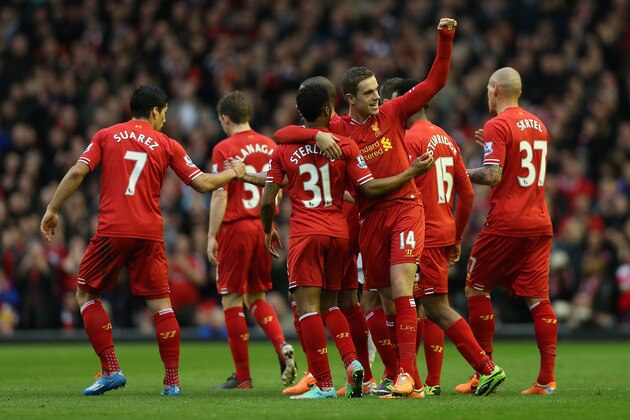 LIVERPOOL, ENGLAND - FEBRUARY 23:  Jordan Henderson of Liverpool celebrates scoring the second goal with his team-mates during the Barclays Premier League match between Liverpool and Swansea City at Anfield on February 23, 2014 in Liverpool, England.  (Photo by Clive Brunskill/Getty Images)