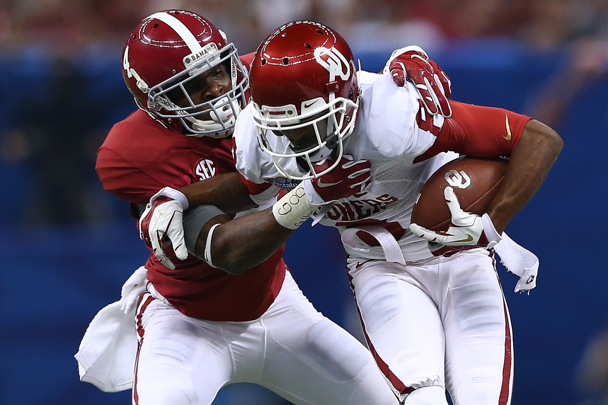NEW ORLEANS, LA - JANUARY 02: Jalen Saunders #8 of the Oklahoma Sooners is tackled by Eddie Jackson #4 of the Alabama Crimson Tide during the Allstate Sugar Bowl at the Mercedes-Benz Superdome on January 2, 2014 in New Orleans, Louisiana. (Photo by Streeter Lecka/Getty Images) NEW ORLEANS, LA - JANUARY 02: Jalen Saunders #8 of the Oklahoma Sooners is tackled by Eddie Jackson #4 of the Alabama Crimson Tide during the Allstate Sugar Bowl at the Mercedes-Benz Superdome on January 2, 2014 in New Orleans, Louisiana. (Photo by Streeter Lecka/Getty Images)