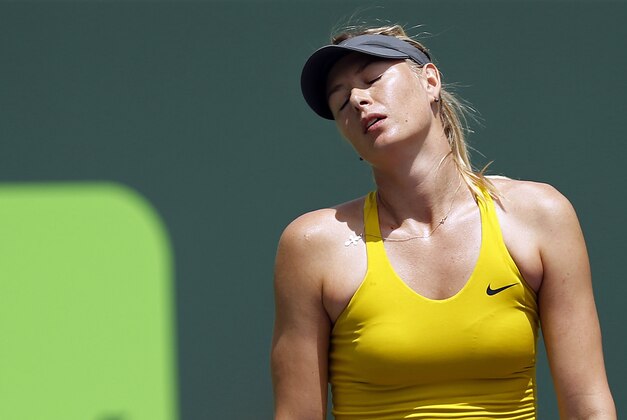 Mar 27, 2014; Miami, FL, USA; Maria Sharapova reacts against Serena Williams (not pictured) on day eleven of the Sony Open at Crandon Tennis Center. Mandatory Credit: Geoff Burke-USA TODAY Sports