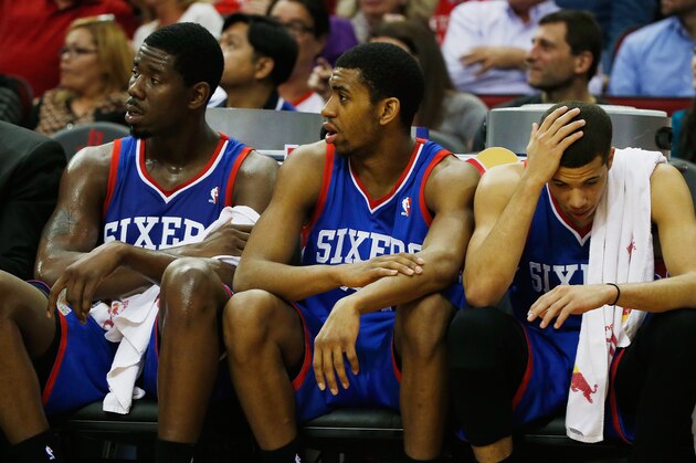 HOUSTON, TX - MARCH 27:  Members of the Philadelphia 76ers (L-R) Henry Sims #35, Hollis Thompson #31 and Michael Carter-Williams wait on the bench during the game against the Houston Rockets at the Toyota Center on March 27, 2014 in Houston, Texas. NOTE TO USER: User expressly acknowledges and agrees that, by downloading and or using this photograph, User is consenting to the terms and conditions of the Getty Images License Agreement.  (Photo by Scott Halleran/Getty Images)