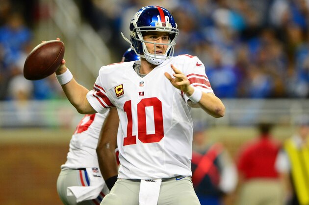 Dec 22, 2013; Detroit, MI, USA; New York Giants quarterback Eli Manning (10) throws a pass during the first quarter against the Detroit Lions at Ford Field. Mandatory Credit: Andrew Weber-USA TODAY Sports
