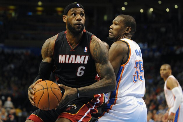 Feb 20, 2014; Oklahoma City, OK, USA; Miami Heat small forward LeBron James (6) handles the ball while being guarded by Oklahoma City Thunder small forward Kevin Durant (35) during the first quarter at Chesapeake Energy Arena. Mandatory Credit: Mark D. Smith-USA TODAY Sports