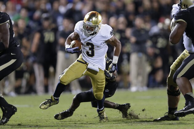 Notre Dame running back Amir Carlisle runs against Purdue during the second half of an NCAA college football game in West Lafayette, Ind., Saturday, Sept. 14, 2013. (AP Photo/Michael Conroy)