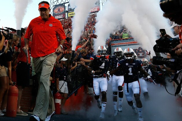 AUBURN, AL - SEPTEMBER 14: Head coach Gus Malzahn of the Auburn Tigers leads his team onto the field to face the Mississippi State Bulldogs at Jordan-Hare Stadium on September 14, 2013 in Auburn, Alabama. (Photo by Kevin C. Cox/Getty Images) AUBURN, AL - SEPTEMBER 14: Head coach Gus Malzahn of the Auburn Tigers leads his team onto the field to face the Mississippi State Bulldogs at Jordan-Hare Stadium on September 14, 2013 in Auburn, Alabama. (Photo by Kevin C. Cox/Getty Images)