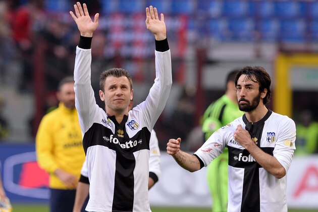 MILAN, ITALY - MARCH 16:  Antonio Cassano of Parma FC (L) celebrates victory at the end of the Serie A match between AC Milan and Parma FC at San Siro Stadium on March 16, 2014 in Milan, Italy.  (Photo by Claudio Villa/Getty Images)