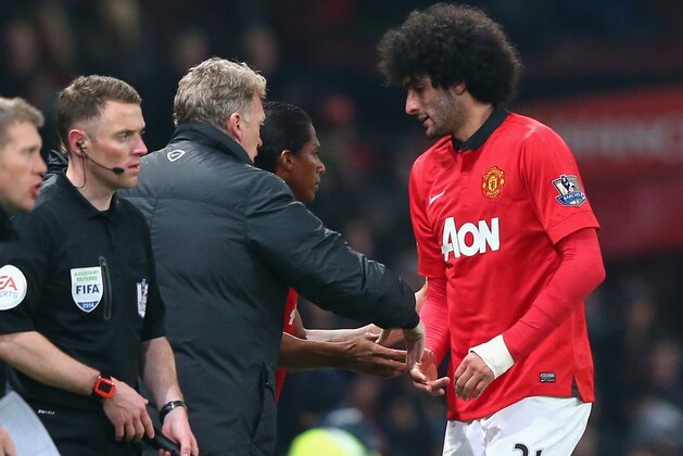 MANCHESTER, ENGLAND - MARCH 25:  Marouane Fellaini of Manchester United is substituted by Manager David Moyes during the Barclays Premier League match between Manchester United and Manchester City at Old Trafford on March 25, 2014 in Manchester, England.  (Photo by Alex Livesey/Getty Images)