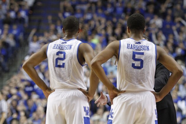 Kentucky's Aaron Harrison (2) and Andrew Harrison (5) during the second half of an NCAA college basketball game, Tuesday, March 4, 2014, in Lexington, Ky. Kentucky won 55-48. (AP Photo/James Crisp)