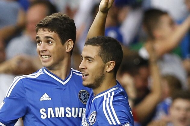 Chelsea's Eden Hazard, right, celebrates scoring a goal with Oscar during the English Premier League soccer match between Chelsea and Aston Villa at Stamford Bridge Stadium in London, Wednesday, Aug. 21, 2013. (AP Photo/Kirsty Wigglesworth)