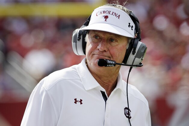 FILE - In this Oct. 12, 2013, file photo, South Carolina coach Steve Spurrier watches from the sideline during the second quarter of an NCAA college football game against Arkansas in Fayetteville, Ark. Spurrier has received a one-year contract extension and a raise that will pay the coach $4 million annually. The university board of trustees approved a $700,000 raise and the extension Thursday, Jan. 16, 2014 . (AP Photo/Danny Johnston, File) FILE - In this Oct. 12, 2013, file photo, South Carolina coach Steve Spurrier watches from the sideline during the second quarter of an NCAA college football game against Arkansas in Fayetteville, Ark. Spurrier has received a one-year contract extension and a raise that will pay the coach $4 million annually. The university board of trustees approved a $700,000 raise and the extension Thursday, Jan. 16, 2014 . (AP Photo/Danny Johnston, File)