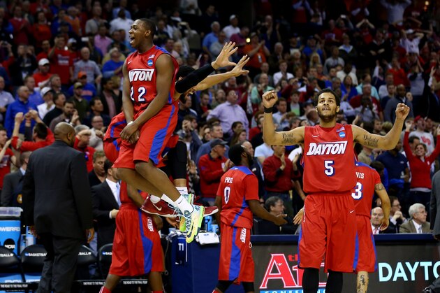 MEMPHIS, TN - MARCH 27: Kendall Pollard #22 and Devin Oliver #5 of the Dayton Flyers celebrate after defeating the Stanford Cardinal 82-72 in a regional semifinal of the 2014 NCAA Men's Basketball Tournament at the FedExForum on March 27, 2014 in Memphis, Tennessee.  (Photo by Streeter Lecka/Getty Images)