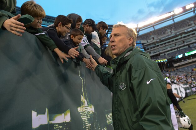 EAST RUTHERFORD, NJ - DECEMBER 22:  General Manager John Idzik shakes hands with fans at the end of the game against the Cleveland Browns at MetLife Stadium on December 22, 2013 in East Rutherford, New Jersey. (Photo by Ron Antonelli/Getty Images)