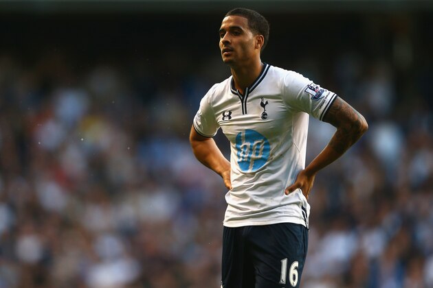 LONDON, ENGLAND - MARCH 16: A dejected Kyle Naughton of Tottenham Hotspur looks on at the final whistle during the Barclays Premier League match between Tottenham Hotspur and Arsenal at White Hart Lane on March 16, 2014 in London, England.  (Photo by Paul Gilham/Getty Images)