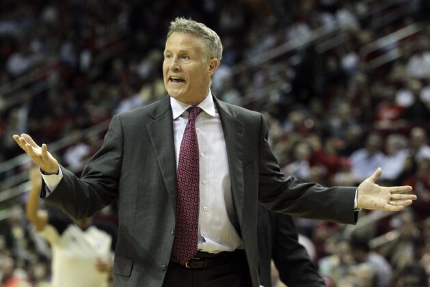 Philadelphia 76ers head coach Brett Brown questions an official's call during the second half of an NBA basketball game against the Houston Rockets, Thursday, March 27, 2014, in Houston. Houston won 120-98. (AP Photo/Bob Levey)