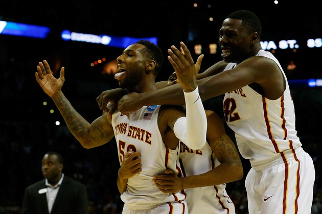SAN ANTONIO, TX - MARCH 23:  DeAndre Kane #50, Monte Morris #11 and Daniel Edozie #42 of the Iowa State Cyclones celebrate after defeating the North Carolina Tar Heels 85-83 in the third round of the 2014 NCAA Men's Basketball Tournament at the AT&T Center on March 23, 2014 in San Antonio, Texas.  (Photo by Tom Pennington/Getty Images)