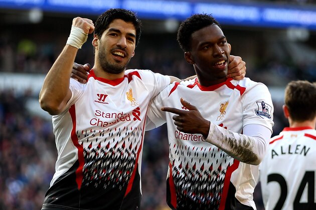 CARDIFF, WALES - MARCH 22:  Daniel Sturridge of Liverpool celebrates with team mate Luis Suarez after scoring his team's fifth goal during the Barclays Premier League match between Cardiff City and Liverpool at Cardiff City Stadium on March 22, 2014 in Cardiff, Wales.  (Photo by Ben Hoskins/Getty Images)