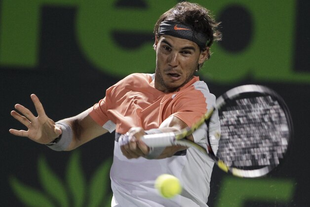 Rafael Nadal, of Spain, returns the ball to Fabio Fognini, of Italy, during the Sony Open tennis tournament, Tuesday, March 25, 2014, in Key Biscayne, Fla. (AP Photo/Luis M. Alvarez)