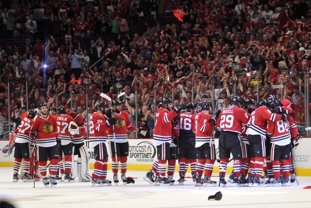 Jun 8, 2013; Chicago, IL, USA; Chicago Blackhawks players celebrate after game five of the Western Conference finals of the 2013 Stanley Cup Playoffs against the Los Angeles Kings at the United Center. The Blackhawks won 4-3 to win the series four games to one. Mandatory Credit: Rob Grabowski-USA TODAY Sports