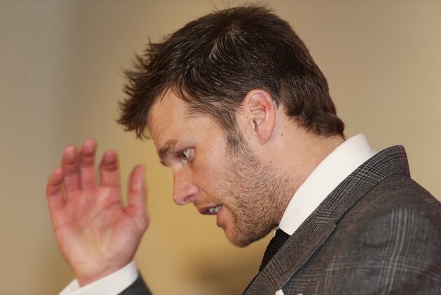 New England Patriots quarterback Tom Brady reacts to question after the Patriots' 26-16 loss to the Denver Broncos in the AFC Championship NFL football game in Denver, Sunday, Jan. 19, 2014. (AP Photo/David Zalubowski)
