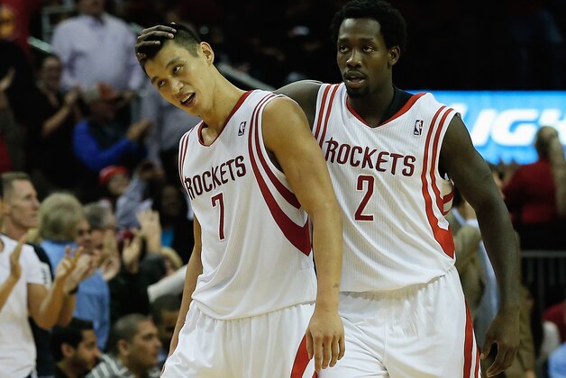 HOUSTON, TX - NOVEMBER 11:  Jeremy Lin #7 and Patrick Beverley #2 of the Houston Rockets celebrate as time winds down in the second overtime period during the game against the Toronto Raptors at Toyota Center on November 11, 2013 in Houston, Texas. NOTE TO USER: User expressly acknowledges and agrees that, by downloading and or using this photograph, User is consenting to the terms and conditions of the Getty Images License Agreement.  (Photo by Scott Halleran/Getty Images)