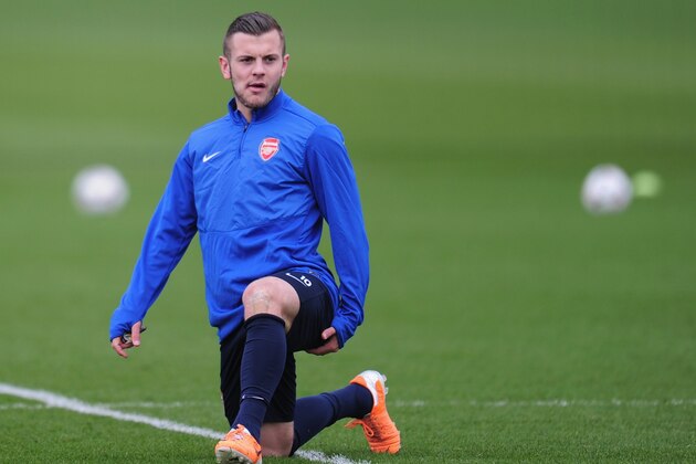 ST ALBANS, ENGLAND - FEBRUARY 18:  Jack Wilshere of Arsenal warms up during a training session at London Colney on February 18, 2014 in St Albans, England.  (Photo by Shaun Botterill/Getty Images)