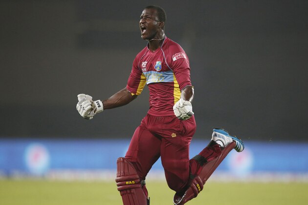 West Indies' captain Darren Sammy runs to celebrate his team's win over Australia in the ICC Twenty20 Cricket World Cup match in Dhaka, Bangladesh, Friday, March 28, 2014. West Indies' won the match by six wickets. (AP Photo/Aijaz Rahi)