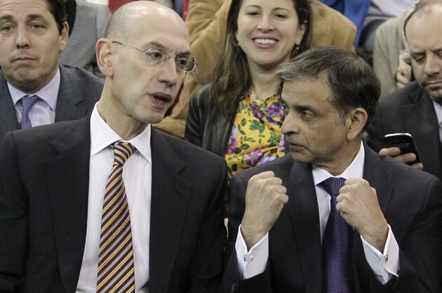 Adam Silver, the new NBA Commissioner, talks with Sacramento Kings majority owner Vivek Ranadive as the Kings play the Toronto Raptors during the first quarter of an NBA basketball game in Sacramento, Calif., Wednesday, Feb. 5, 2014. Silver replaced David Stern Feb. 1,  who retired after 30 years as the head of the NBA. (AP Photo/Rich Pedroncelli)