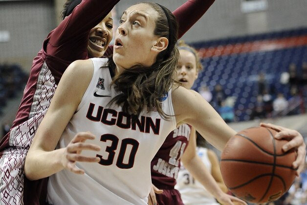 Connecticut's Breanna Stewart, right, pushes past Saint Joseph's Ashley Robinson, left, during the second half of a second-round game of the NCAA women's college basketball tournament, Tuesday, March 25, 2014, in Storrs, Conn. (AP Photo/Jessica Hill)