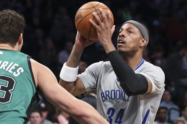 Brooklyn Nets forward Paul Pierce (34) looks to shoot over Boston Celtics center Kris Humphries (43) during the second half of an NBA basketball game at the Barclays Center, Friday, March 21, 2014, in New York. The Nets defeated the Celtics, 114-98. (AP Photo/John Minchillo) Brooklyn Nets forward Paul Pierce (34) looks to shoot over Boston Celtics center Kris Humphries (43) during the second half of an NBA basketball game at the Barclays Center, Friday, March 21, 2014, in New York. The Nets defeated the Celtics, 114-98. (AP Photo/John Minchillo)