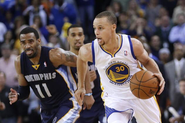 Golden State Warriors guard Stephen Curry (30) dribbles next to Memphis Grizzlies guard Mike Conley (11) during the second half of an NBA basketball game Friday, March 28, 2014, in Oakland, Calif. Oakland won 100-93. (AP Photo/Marcio Jose Sanchez)