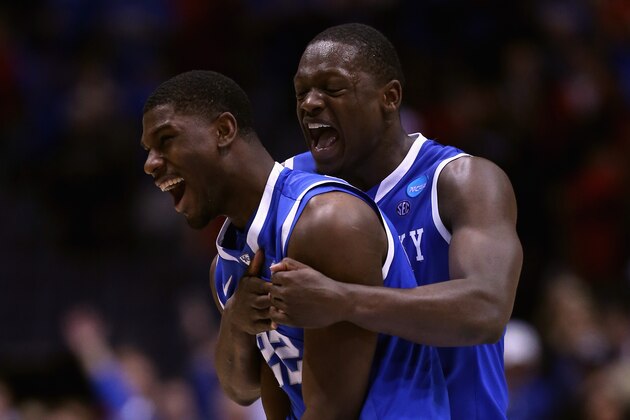 INDIANAPOLIS, IN - MARCH 28:  Alex Poythress #22 and Julius Randle #30 of the Kentucky Wildcats celebrate defeating the Louisville Cardinals 74 to 69 during the regional semifinal of the 2014 NCAA Men's Basketball Tournament at Lucas Oil Stadium on March 28, 2014 in Indianapolis, Indiana.  (Photo by Jonathan Daniel/Getty Images)
