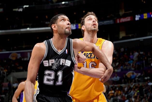 LOS ANGELES, CA - MARCH 19: Tim Duncan #21 of the San Antonio Spurs battles for position against Pau Gasol #16 of the Los Angeles Lakers at Staples Center on March 19, 2014 in Los Angeles, California. NOTE TO USER: User expressly acknowledges and agrees that, by downloading and/or using this Photograph, user is consenting to the terms and conditions of the Getty Images License Agreement. Mandatory Copyright Notice: Copyright 2014 NBAE (Photo by Andrew D. Bernstein/NBAE via Getty Images)
